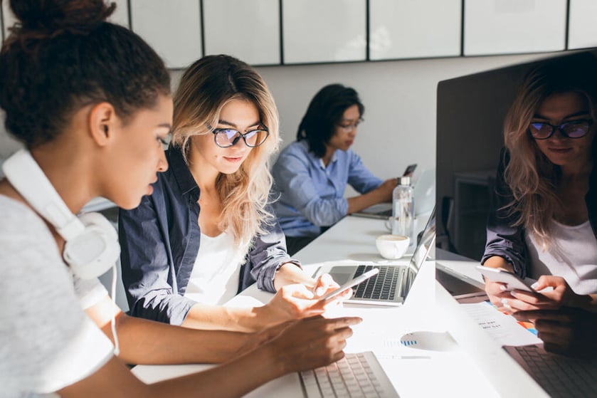 picture of outsourcing team members working at their laptops